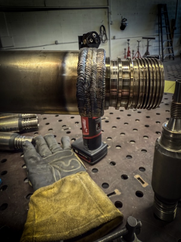 Multi-pass weld build-up on a threaded coupling
