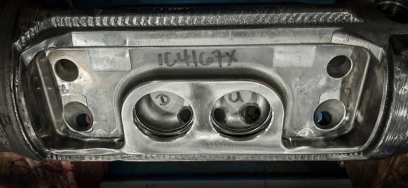 Finished back side of a welded bracket assembly